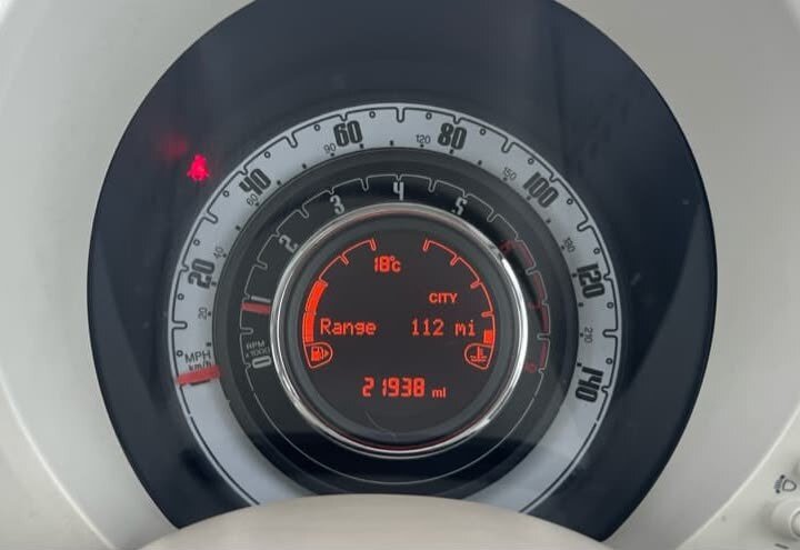 Repaired Fiat 500 instrument cluster back in the car, display showing range, temperature and the original mileage