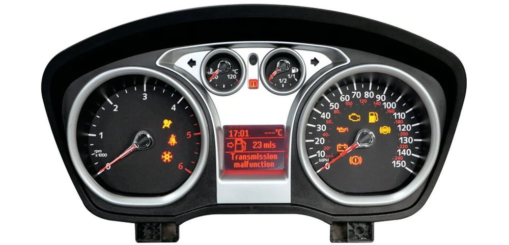 Ford dashboard panel with large speedometer dial and red centre display, the type repaired for stuck or dead speedos in Surrey